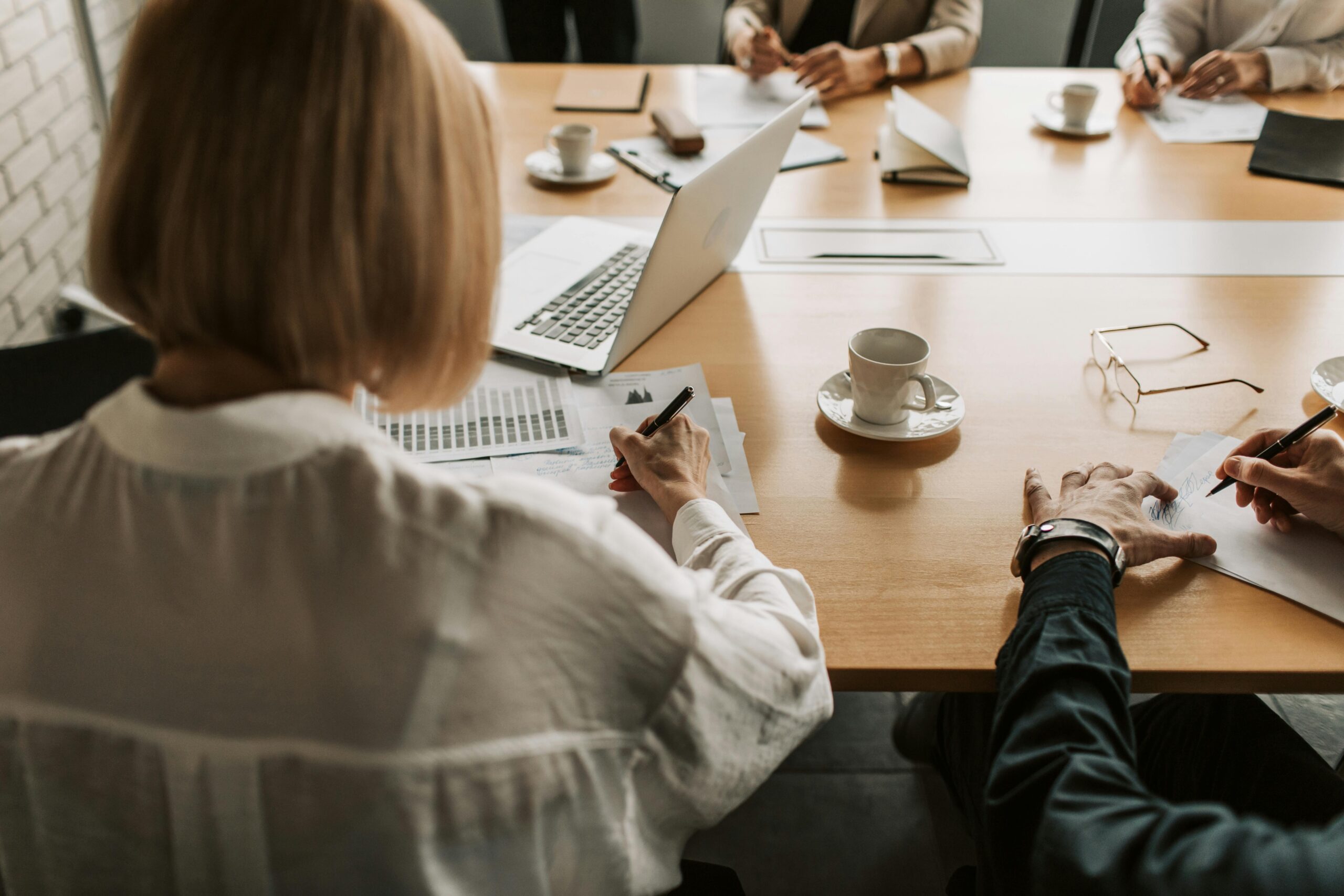 office meeting woman writing professional communications